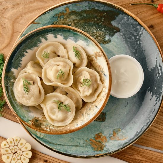 Пельмени из щуки со сметаной
